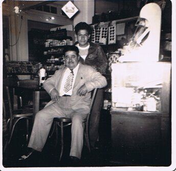 Victor S. Ortiz and his son Victor C. Ortiz inside the pharmacy, 1952